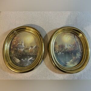 A pair of vintage oval pictures depicting a church and outside nature